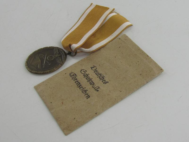 Westwall Medal with Paper Bag