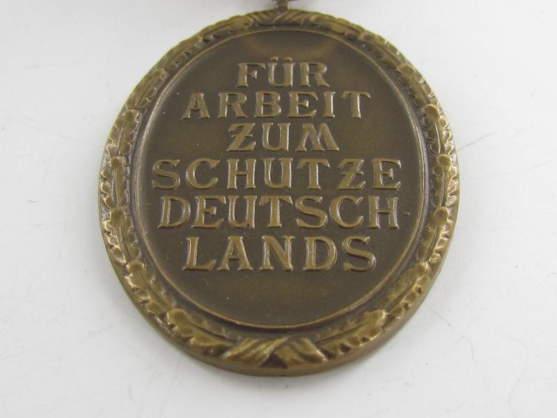 Westwall Medal with Paper Bag