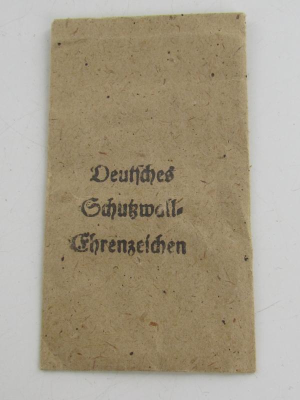 Westwall Medal with Paper Bag