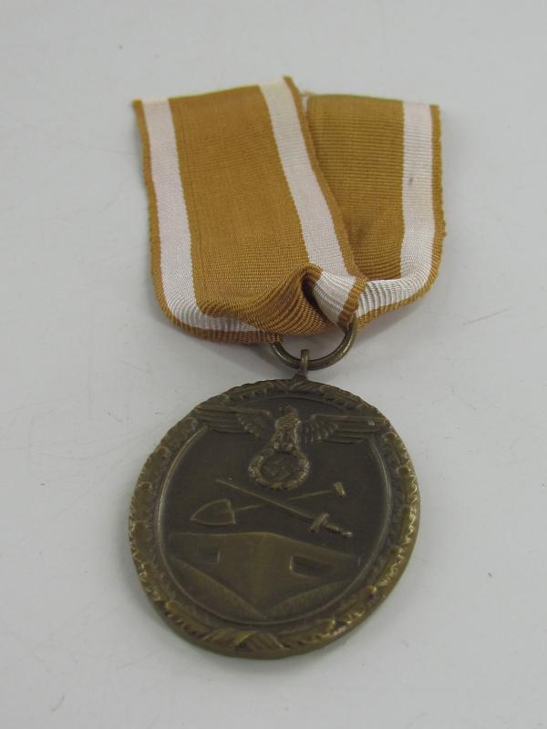 Westwall Medal with Paper Bag