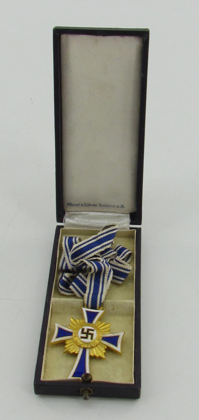 Mother’s cross in gold with box ( Klamt und Söhne )