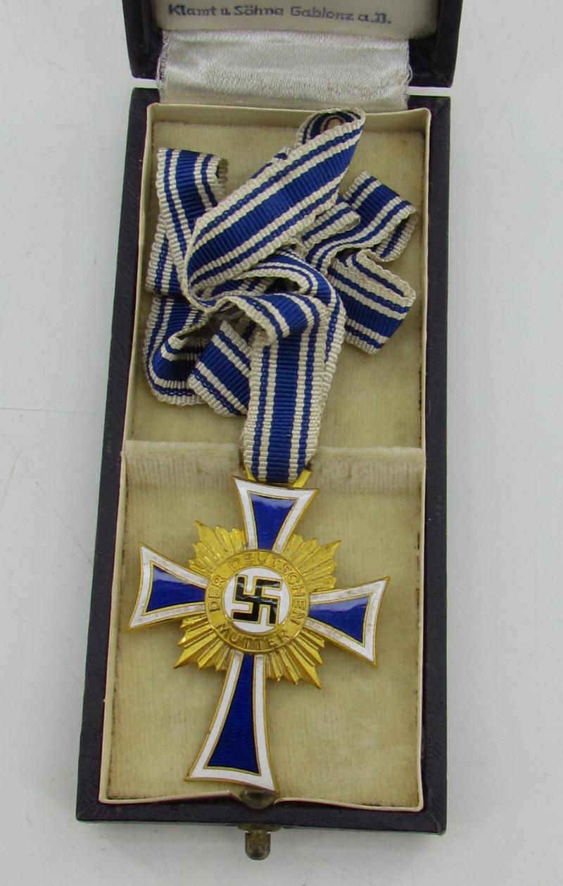 Mother’s cross in gold with box ( Klamt und Söhne )