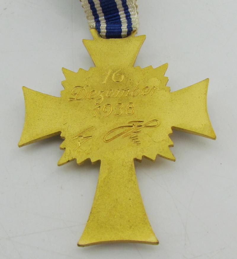 Mother’s cross in gold with box ( Klamt und Söhne )