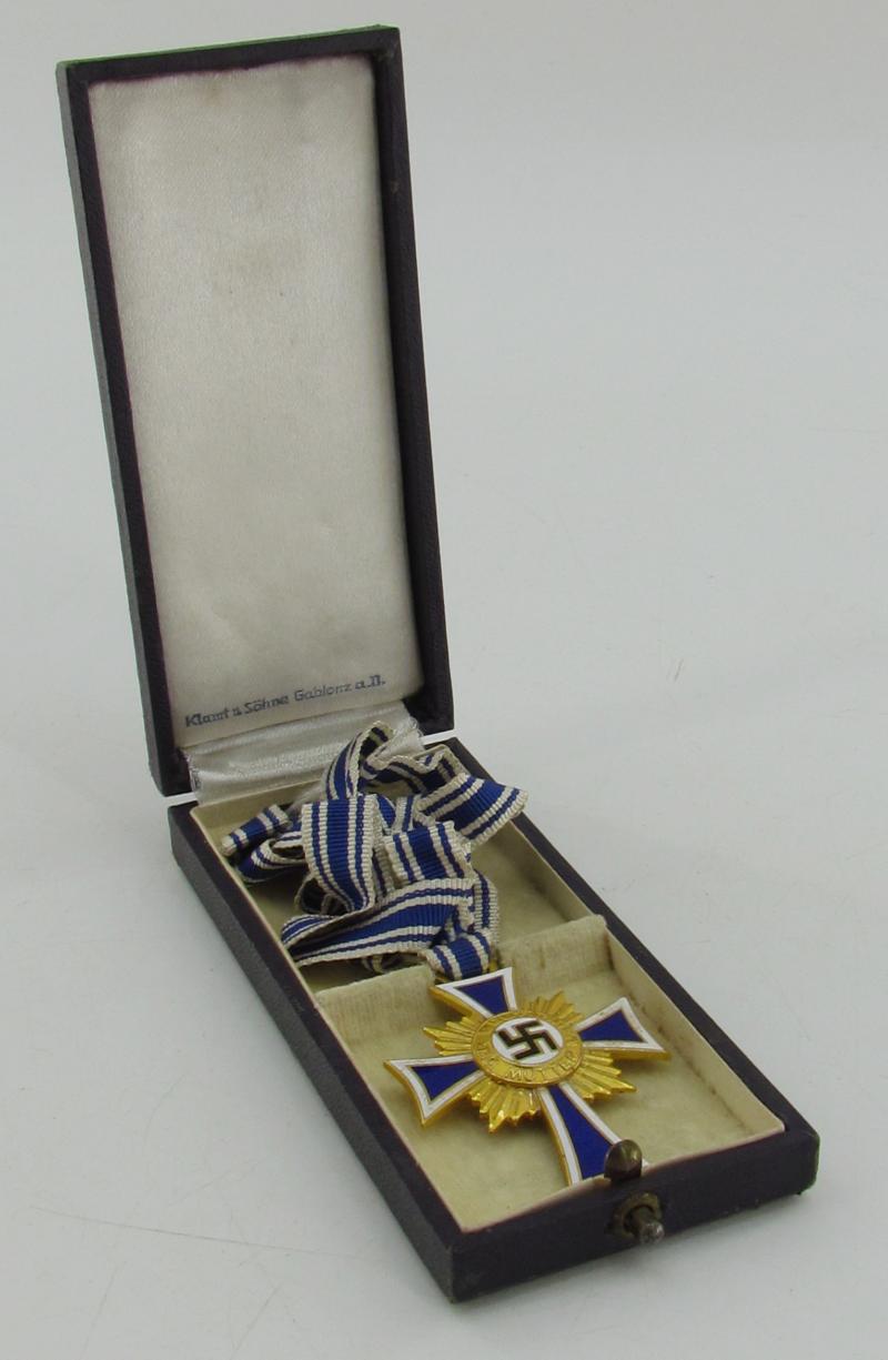 Mother’s cross in gold with box ( Klamt und Söhne )